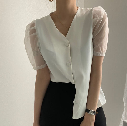 White buttoned blouse with clear sleeve